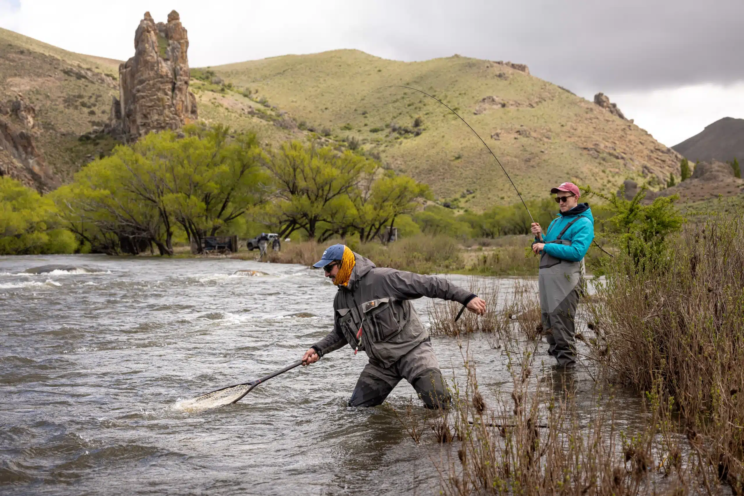 two fly fishermen wading in the Malleo river