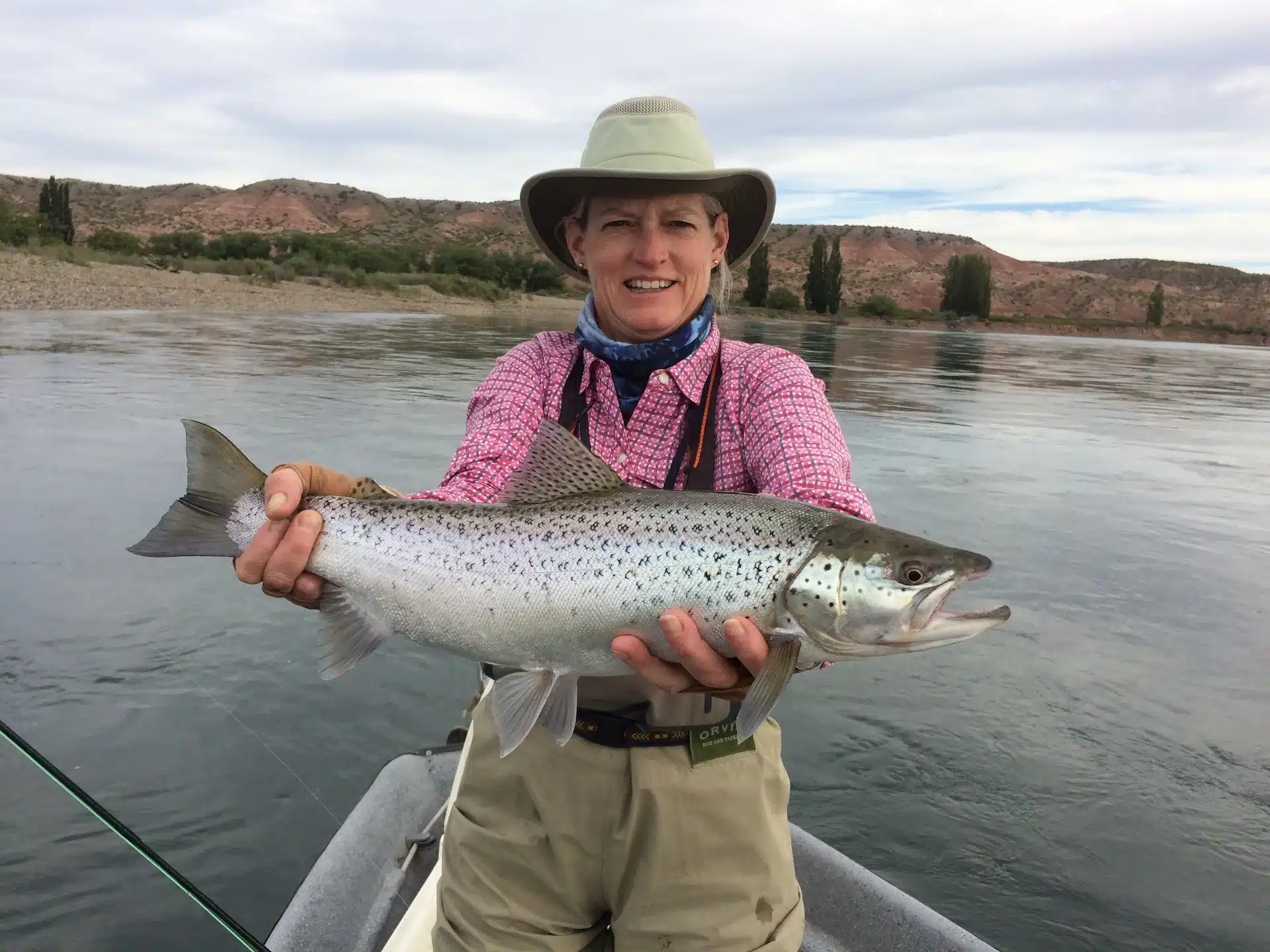 fishermen with large trout limay river patagonia